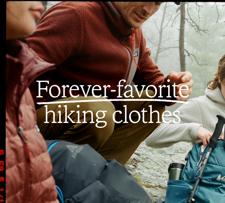 Fall hiker smiles to friends. Headline: Forever-favorite hiking clothes