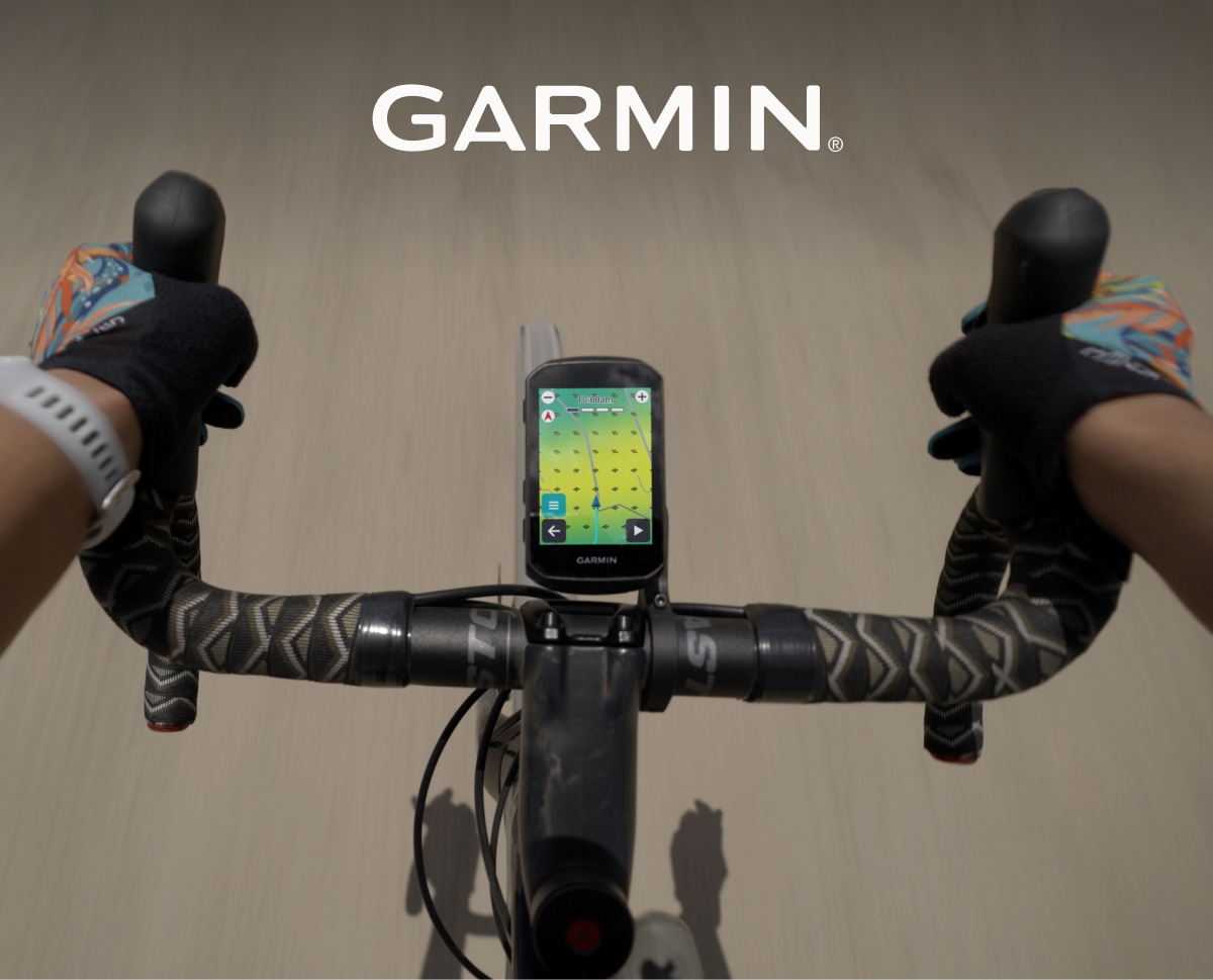 A view from above of a person riding their bike with a Garmin bike computer.