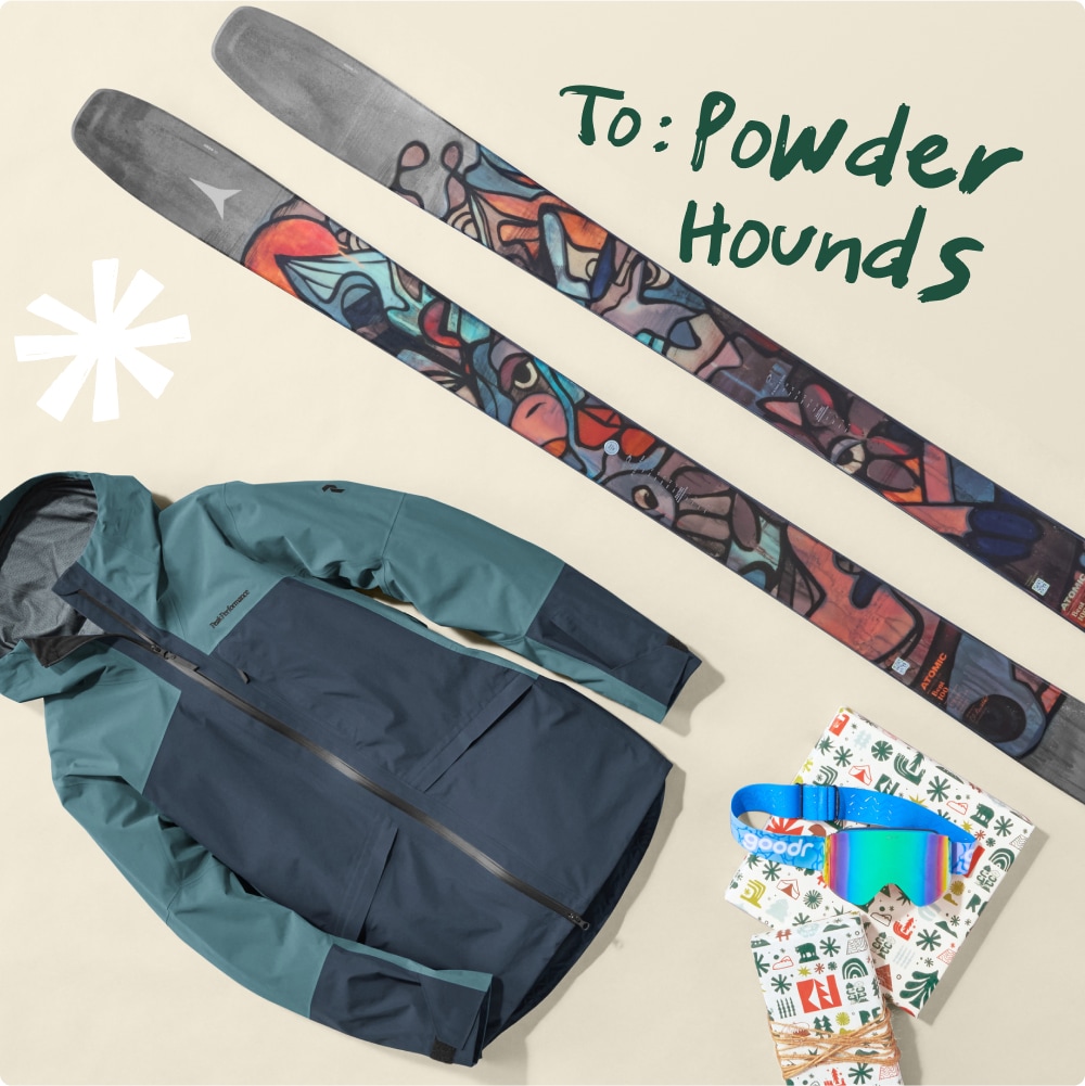 To: Powder hounds. A jacket, skis, a pair of goggles, and wrapped holiday gifts.