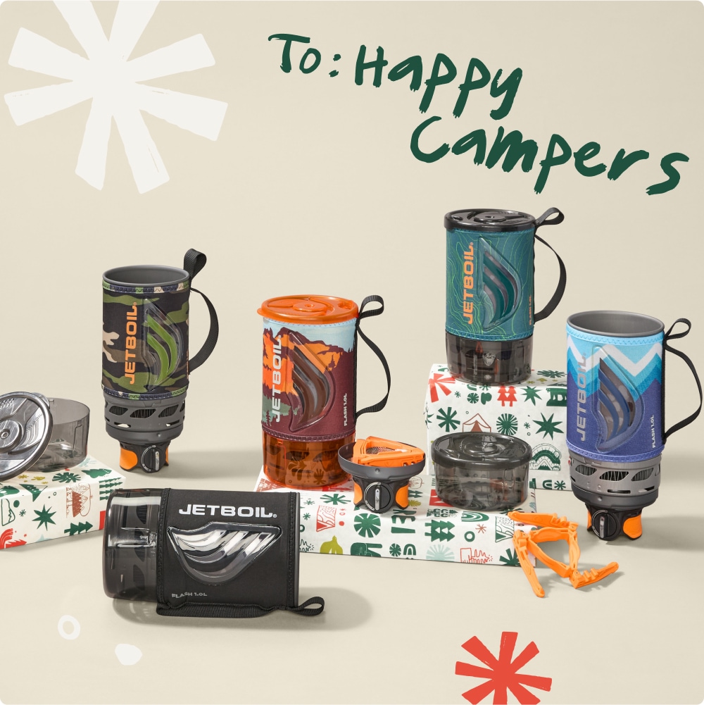 To: Happy campers. Jetboil cooking systems sitting on top of wrapped gifts.