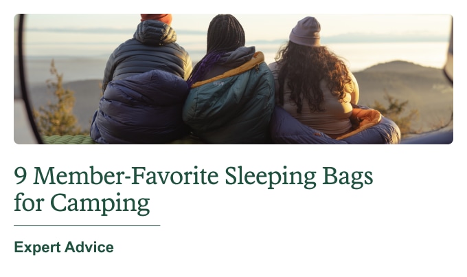 A trio of campers swaddled in sleeping bags. Headline: 9 Member‑Favorite Sleeping Bags for Camping. Expert Advice