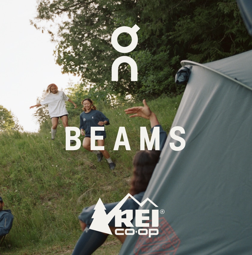 A logo that includes On, Beams and R-E-I over an image of two people running through a field.