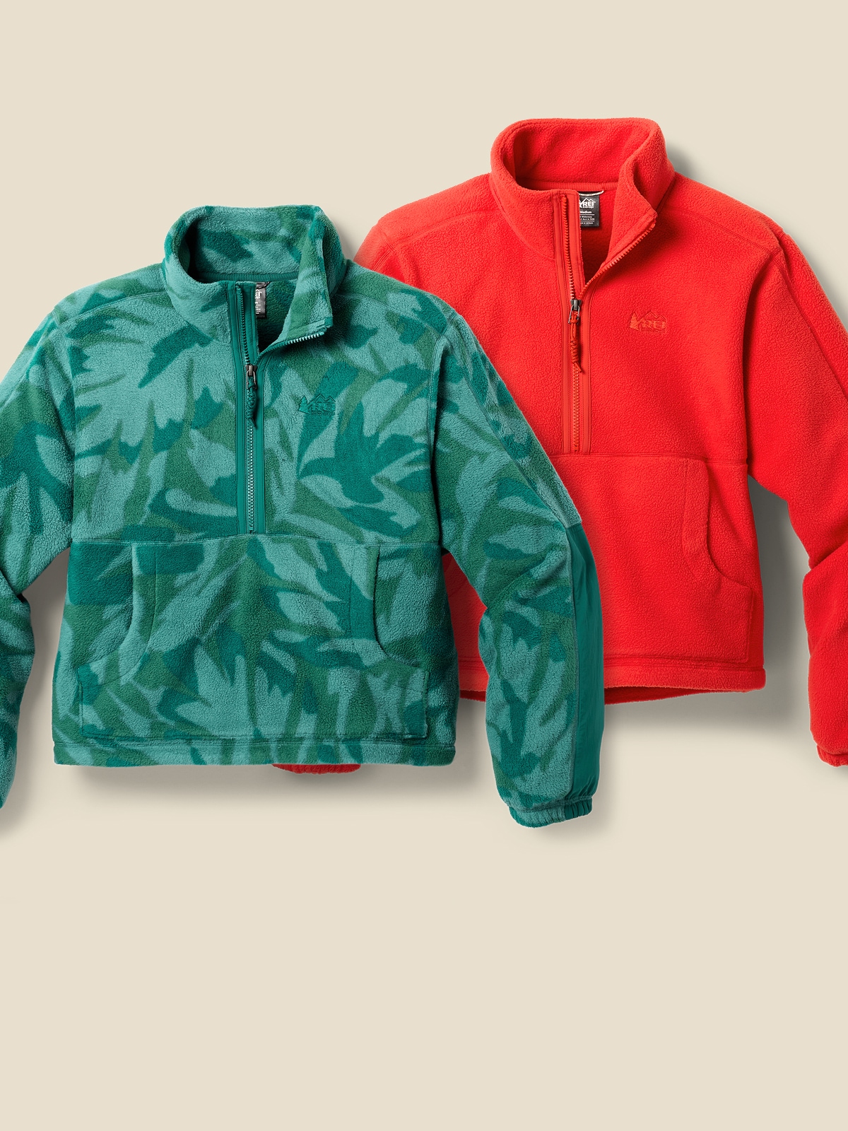 Two R E I Co-op brand fleece jackets.