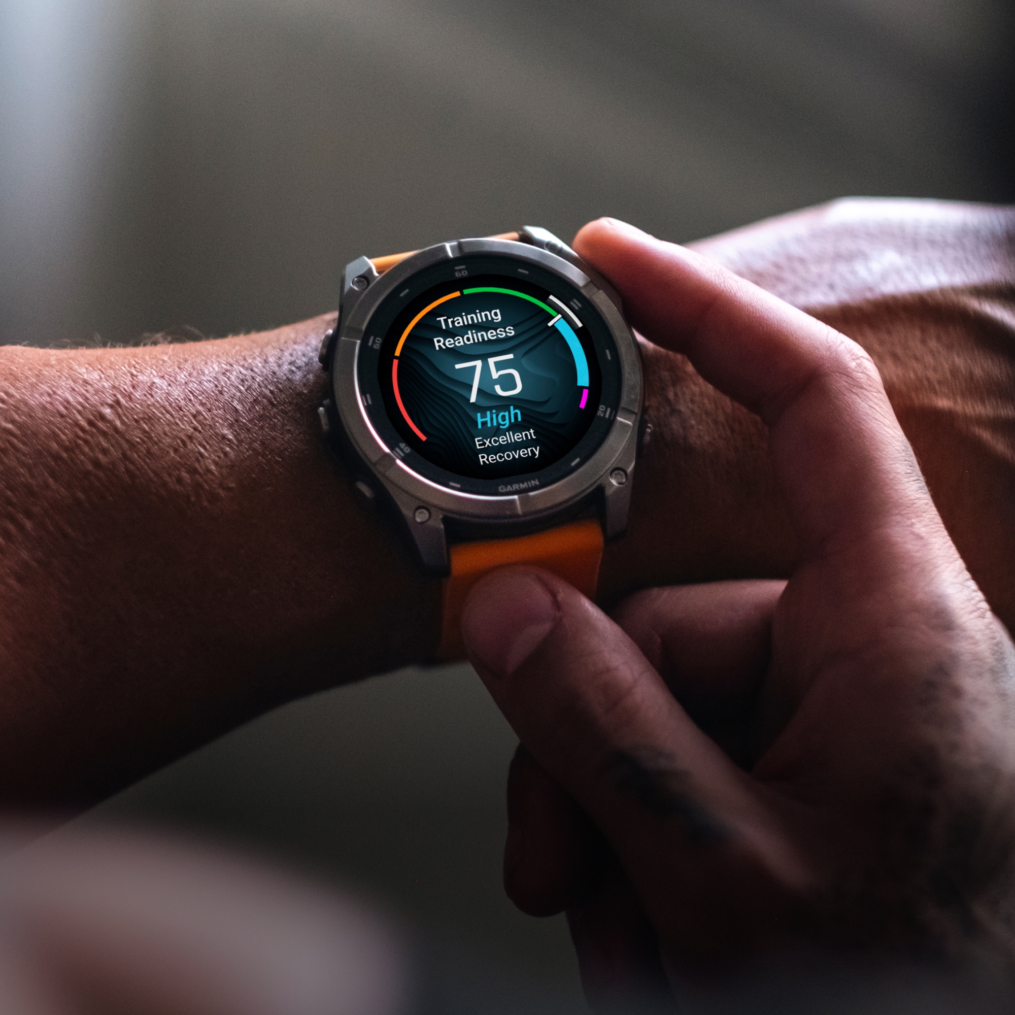 A person switches through features on their Garmin watch.