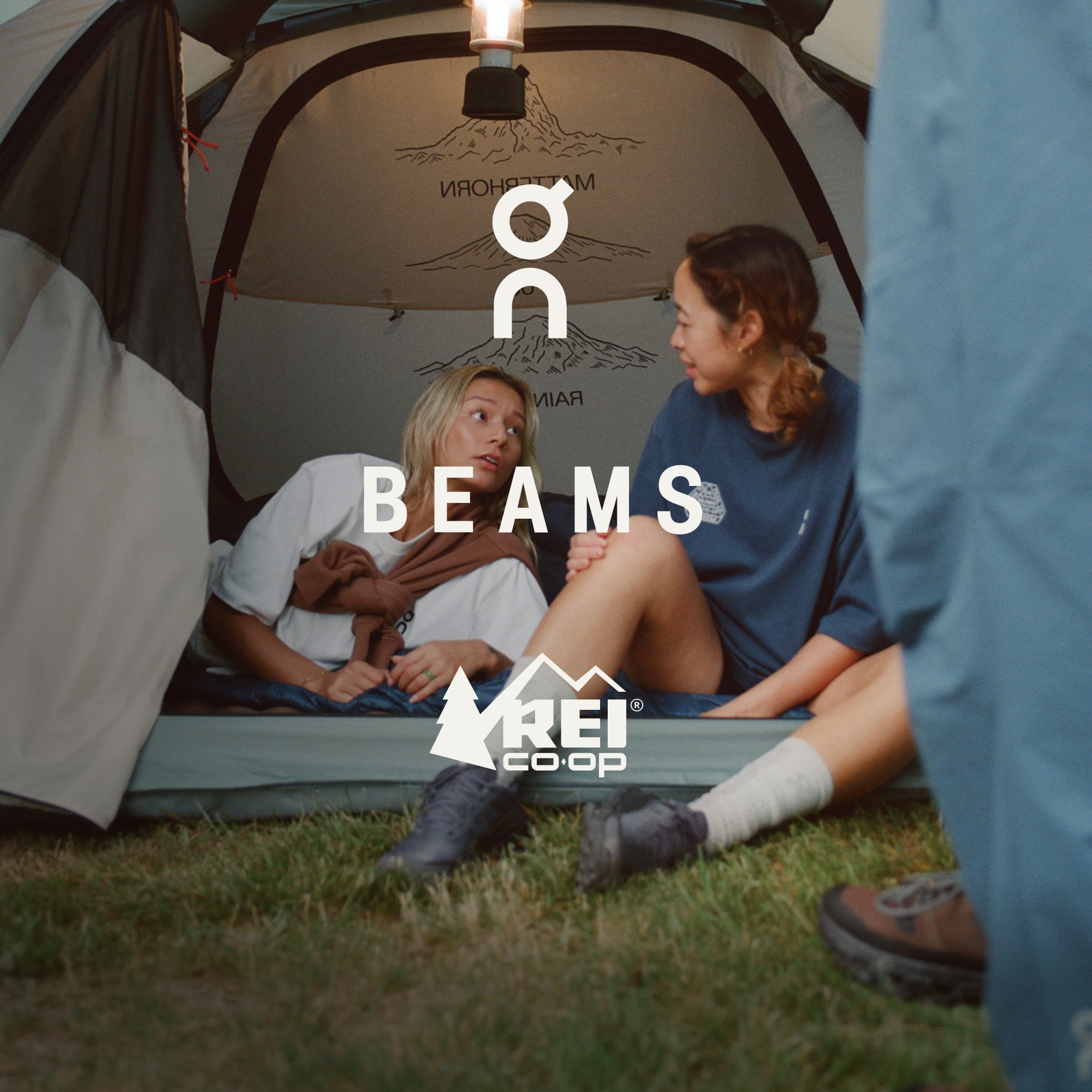 A logo that includes On, Beams and R E I Co-op over an image of two people running through a field, a person in a chair and someone in a tent. 