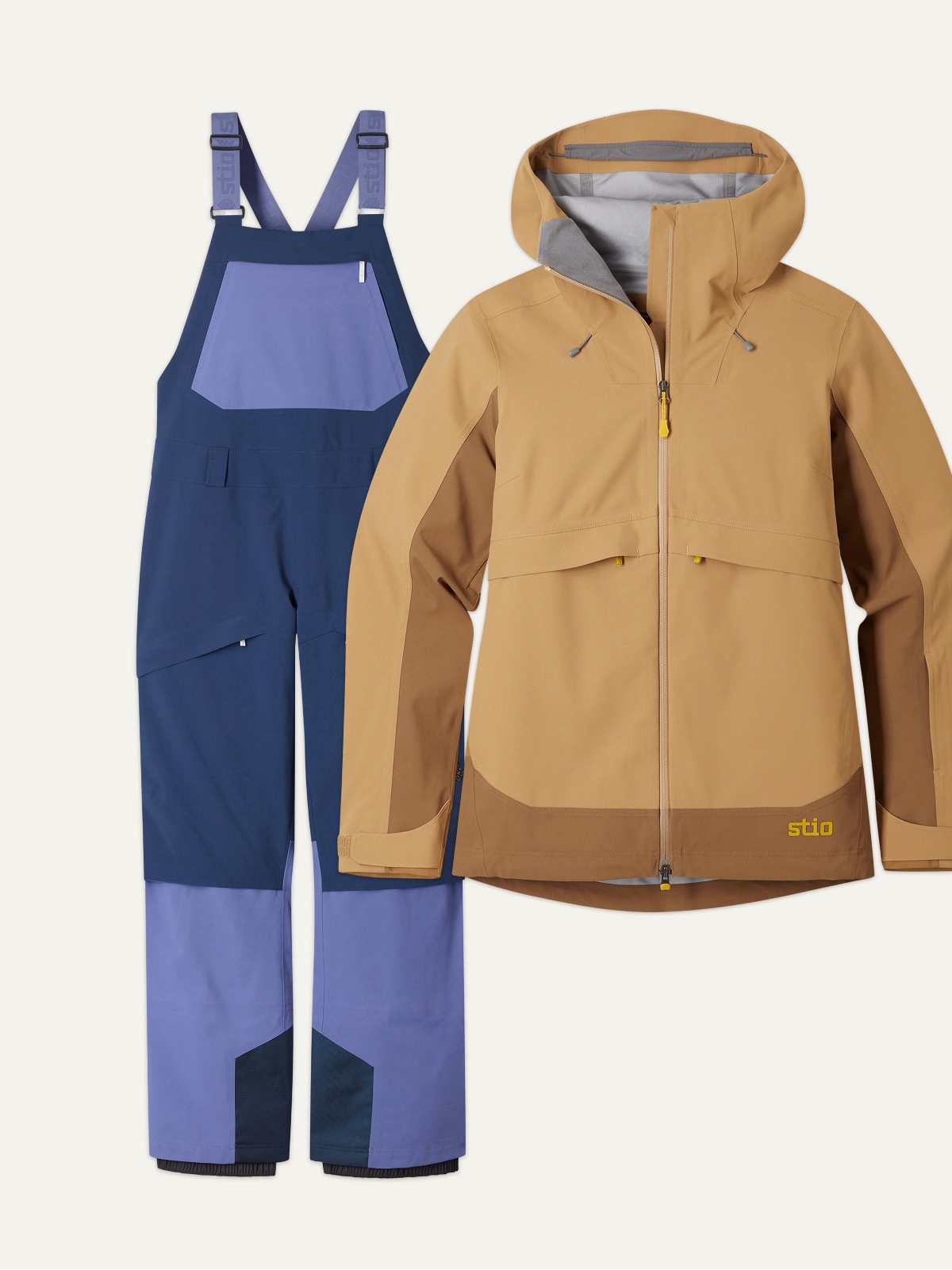 A Stio jacket and bib on a light colored background.