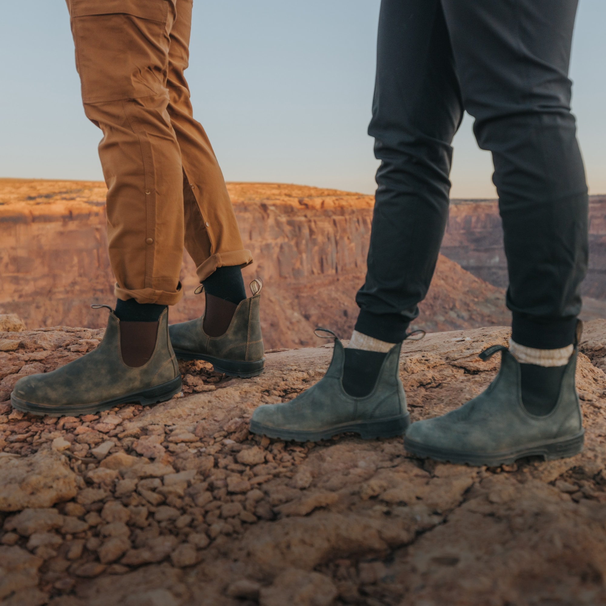 Blundstone, Sorel, & Salomon. Two people stand on top of a rock in their Blundstone boots.