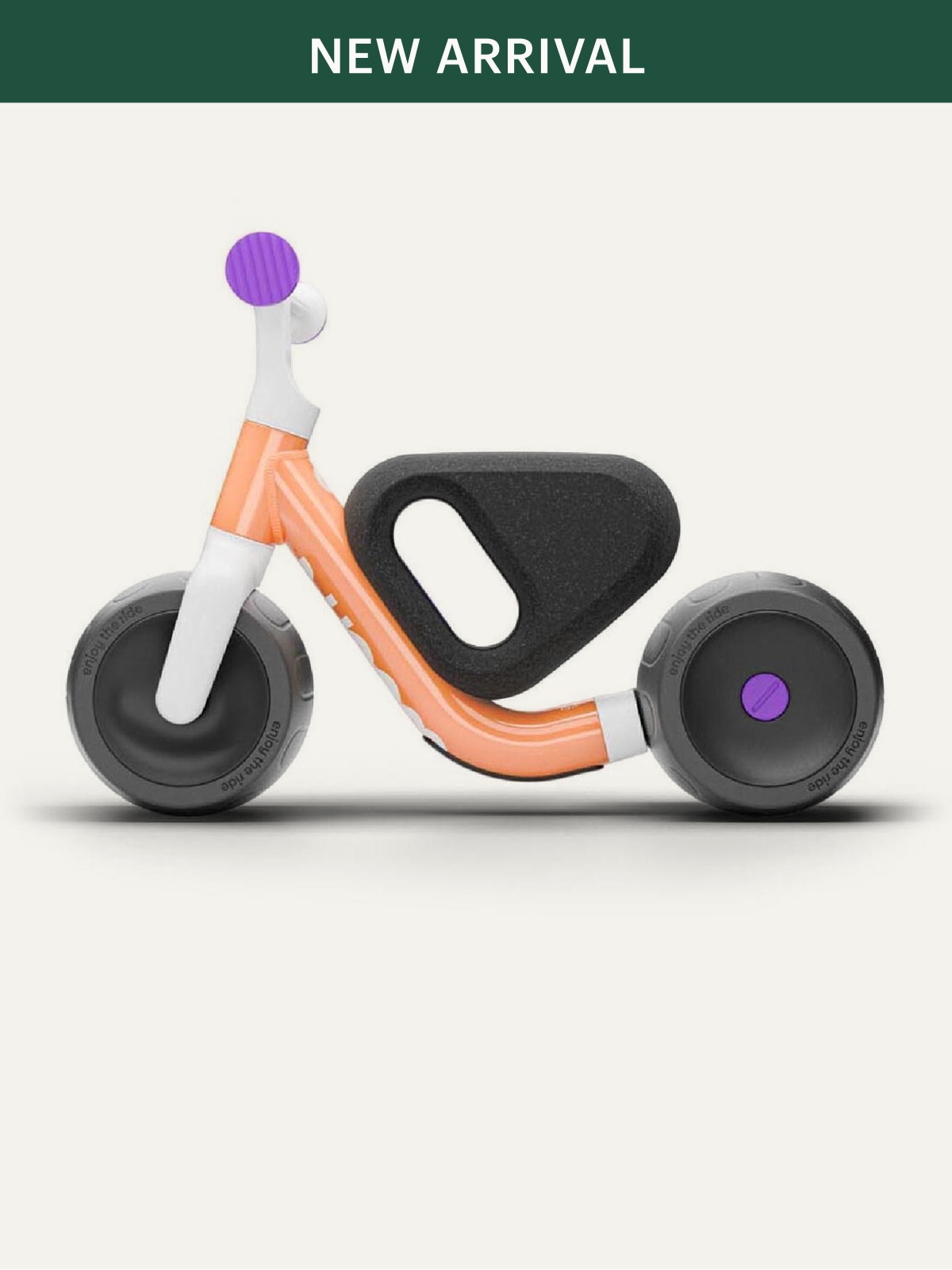 A woom bike on a light colored background.