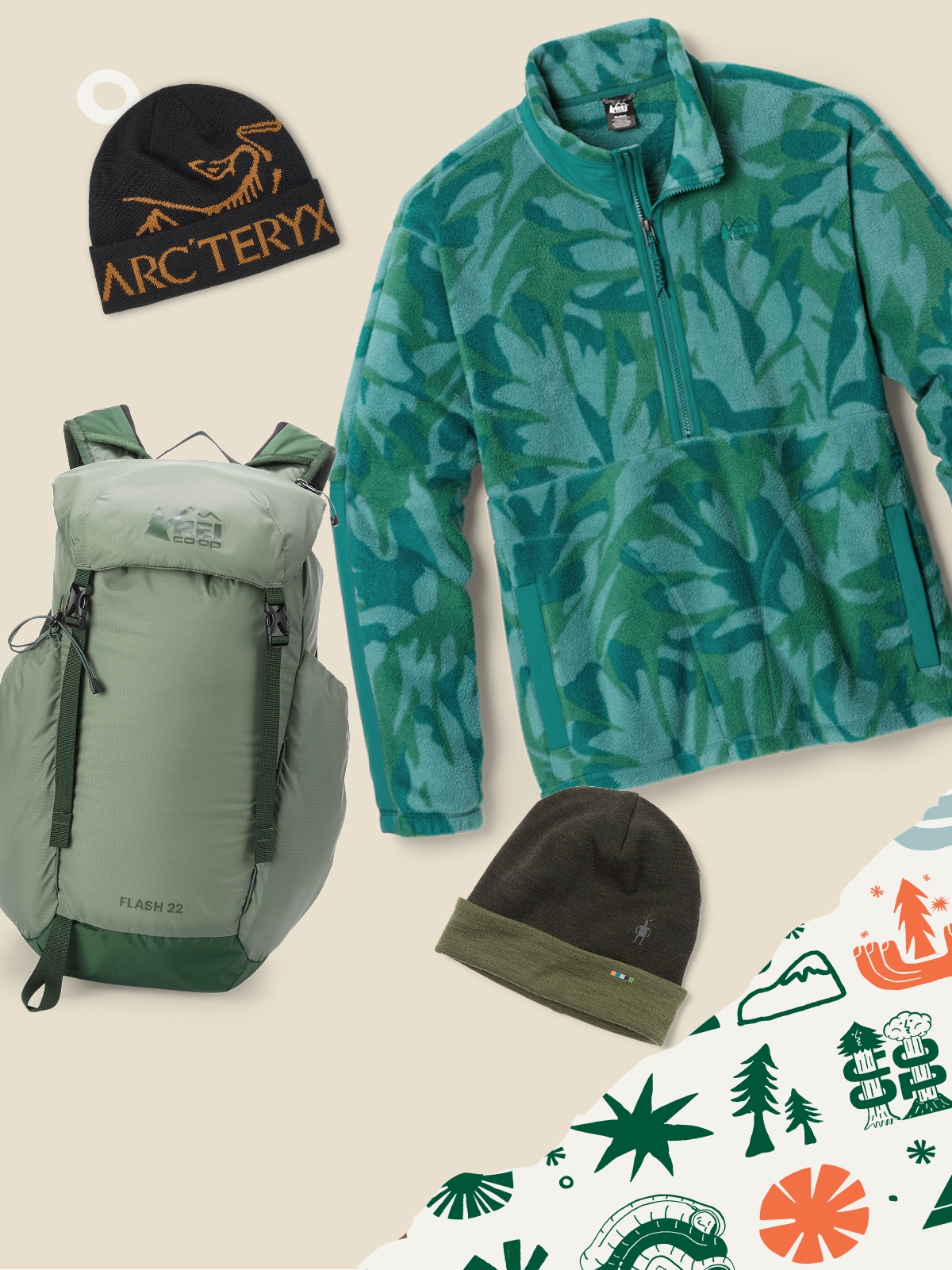 A fleece jacket, Flash 22 pack, & two beanies on a light colored background with holiday wrapping paper in the corner.