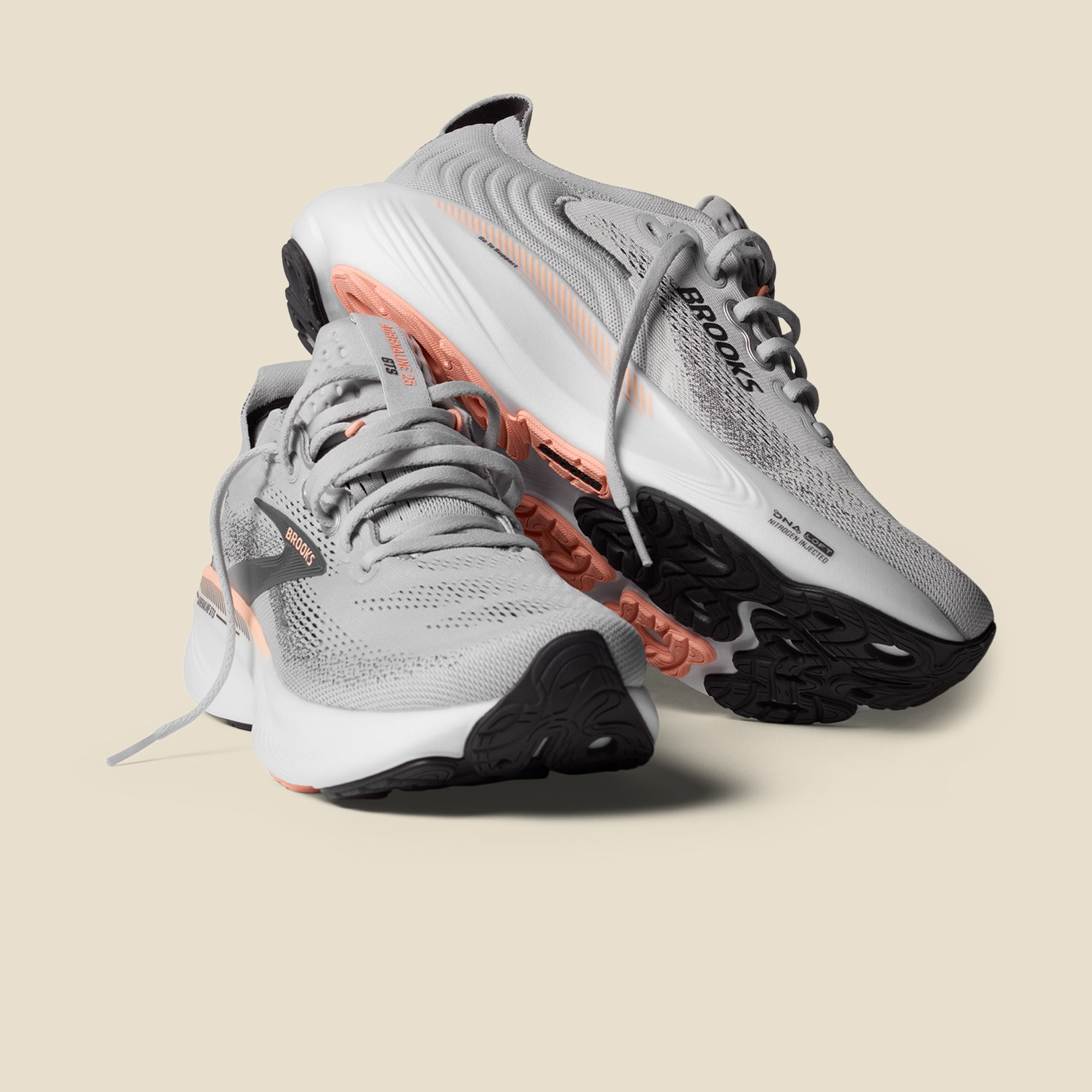 A pair of Brooks Adrenaline 25 GTS running shoes on a light colored background.
