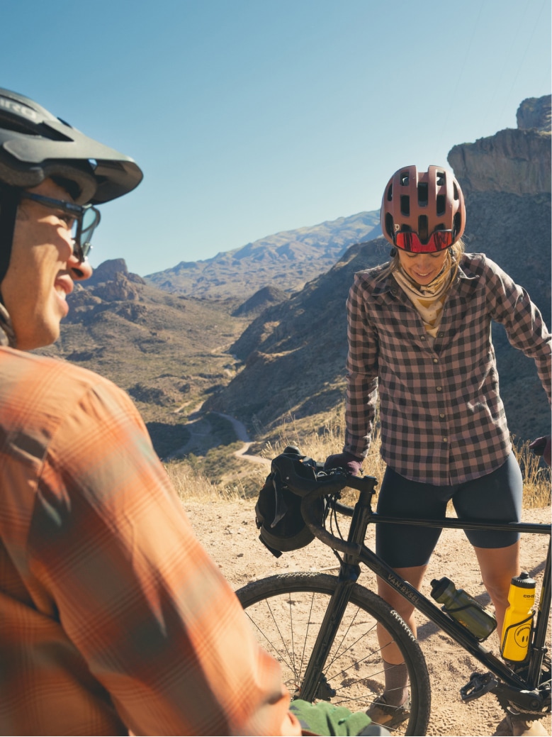 Two bikers stop to take a break during their ride.