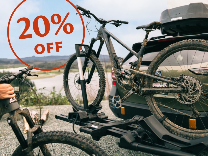 20% off. A bike sits on a car rack.