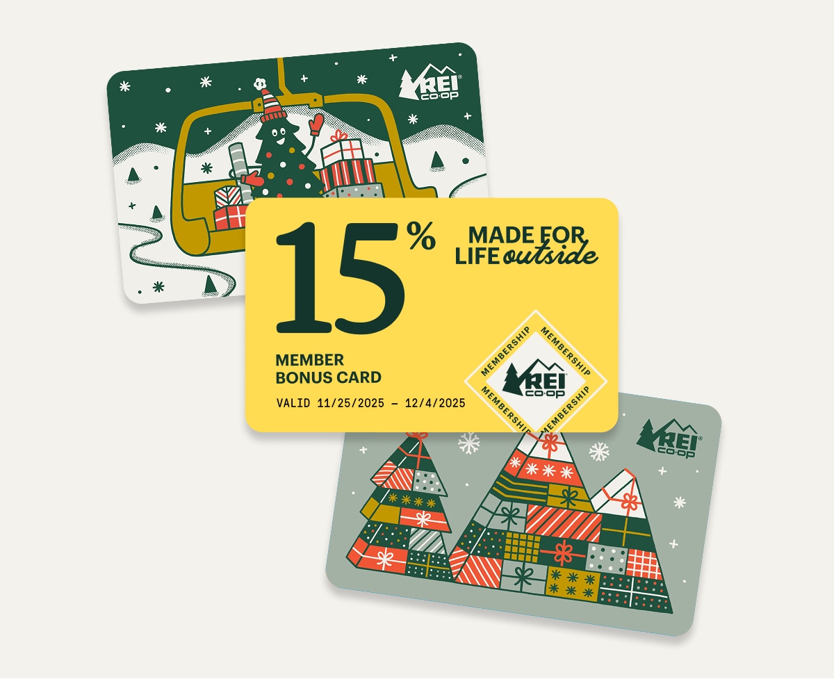 Two holiday-themed gift cards and a yellow member bonus card that reads ‘15%, made for life outside.’