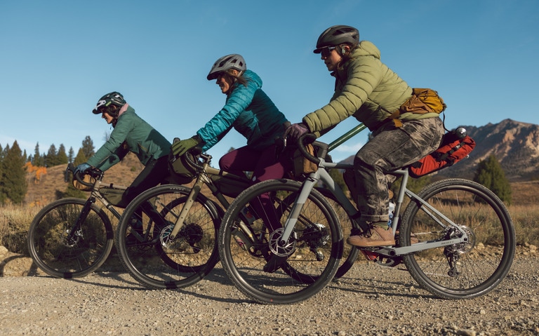 Three bikes dressed for cold winter conditions wear gloves.