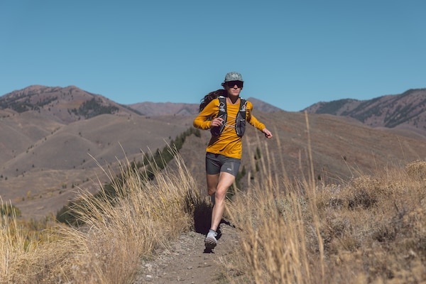 A person runs along a dirt trail.