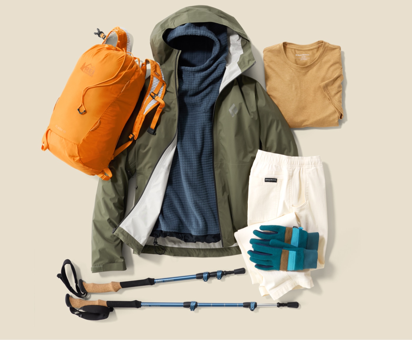 A collage of clothing and gear on a light colored background.