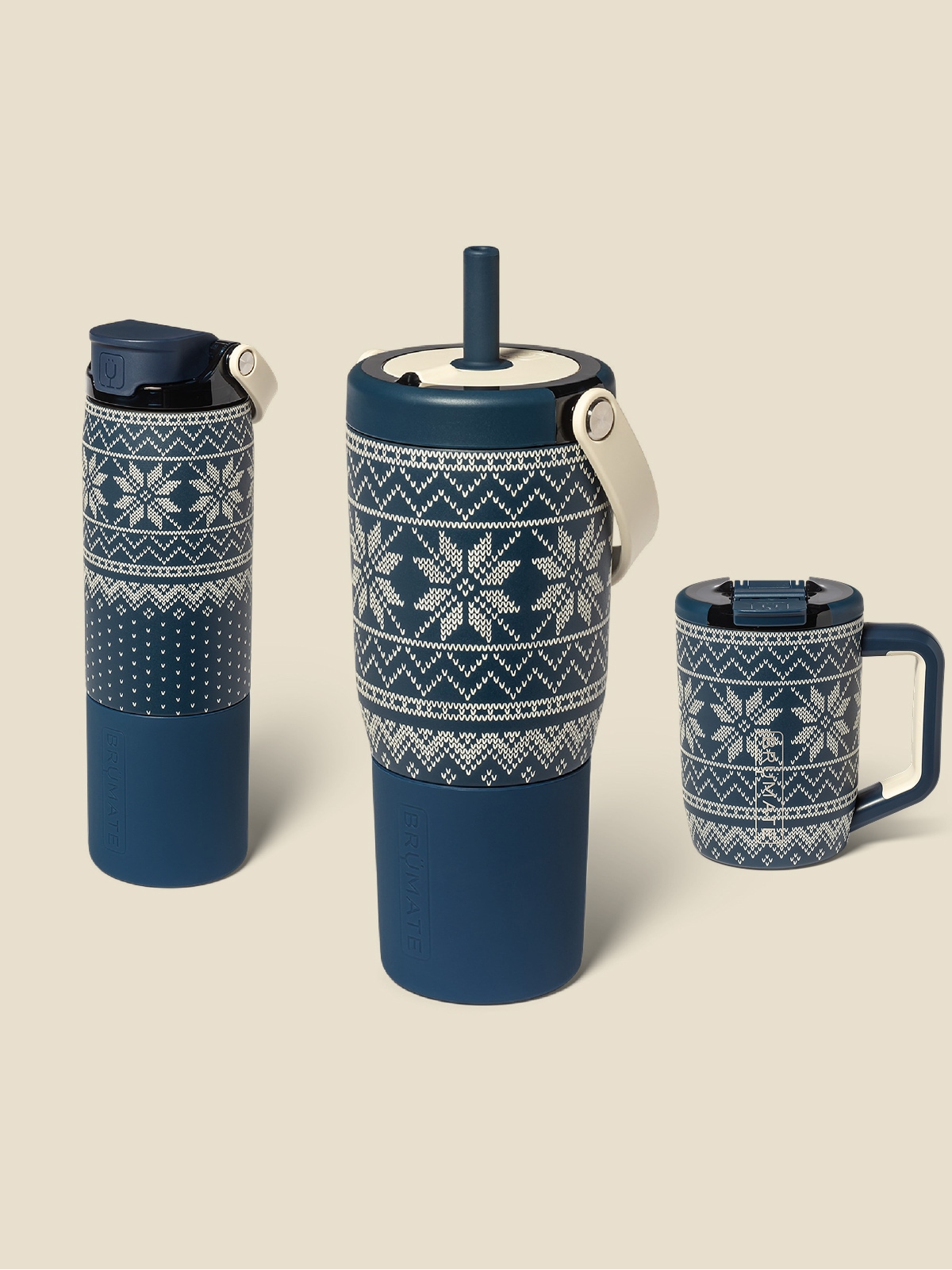 Three fair isle BruMate cups on a light colored background.