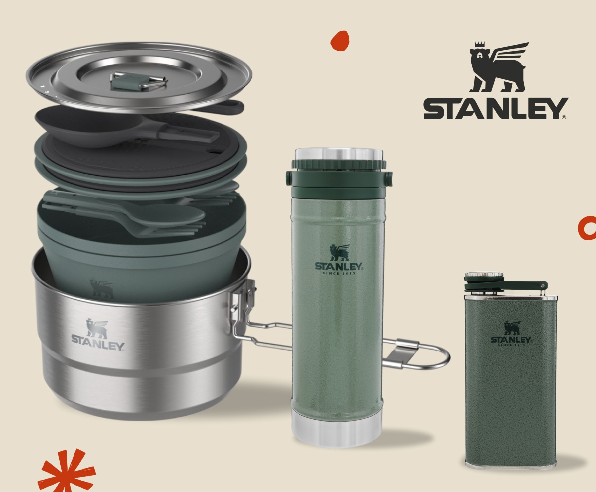 Stanley cookware and drinkware over a light colored background.