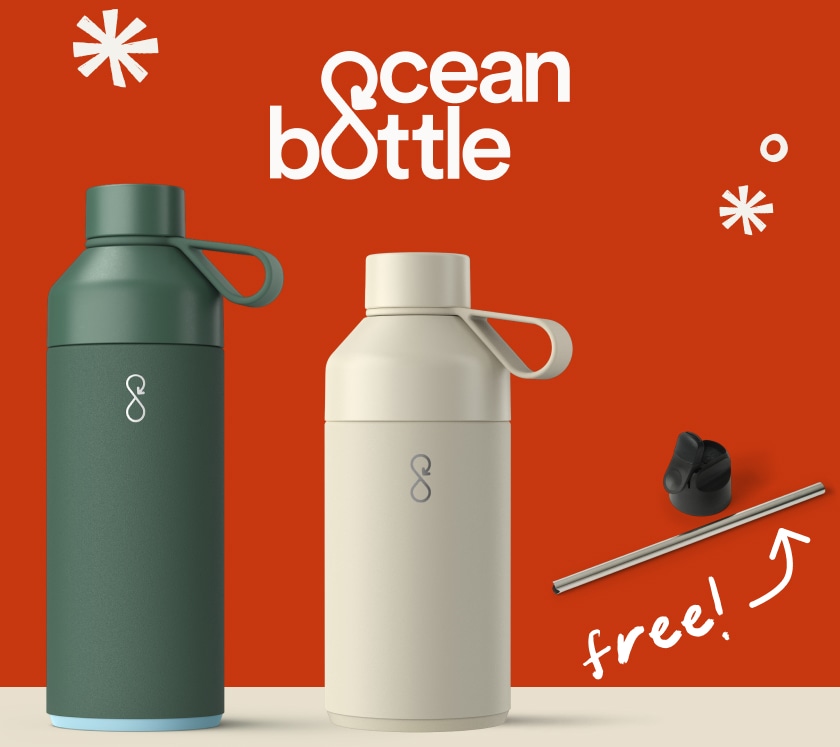 Two Ocean Bottles, an aluminum straw, and a lid over a red background.