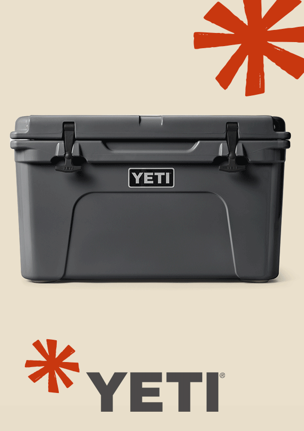 A cooler, french press, and stackable cup from YETI on a light colored background with snowflakes.