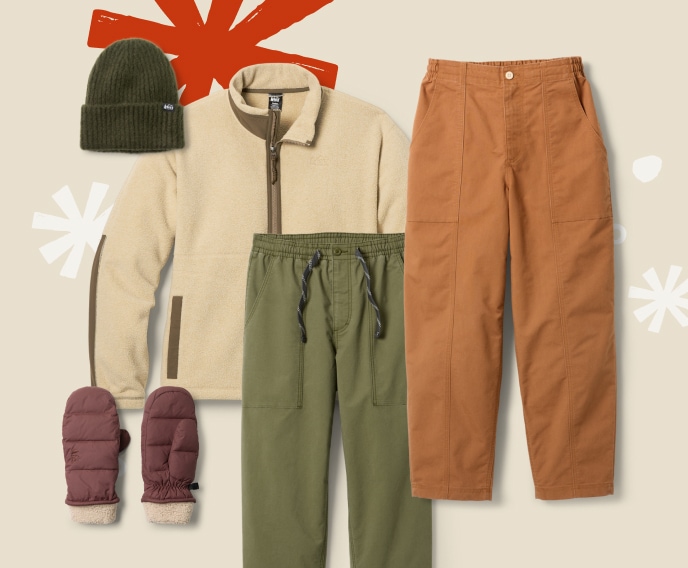 A collage of R E I Co-op brand clothing & accessories on a light colored background with snowflakes.