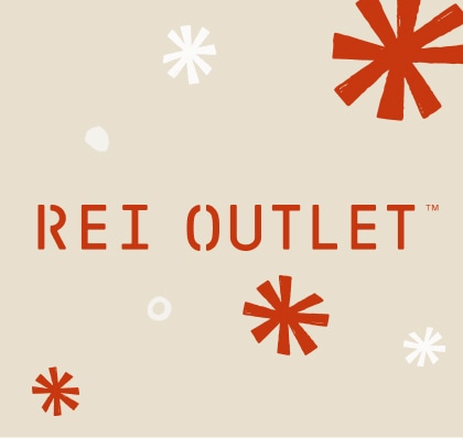 Text reads: ‘R E I Outlet’ on a light colored background with snowflakes.