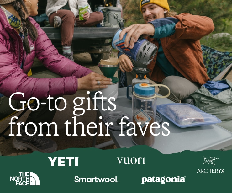 A group gathers around a camp table making coffee and having lunch. Headline: Go-to gifts from their faves