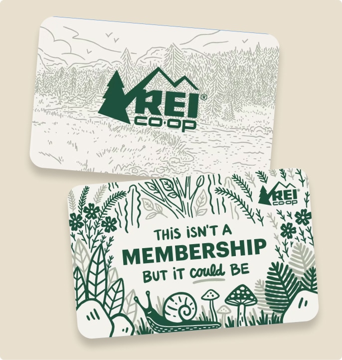 Two R E I gift cards with hand-drawn nature images and text that reads ‘This isn’t a membership but it could be.’