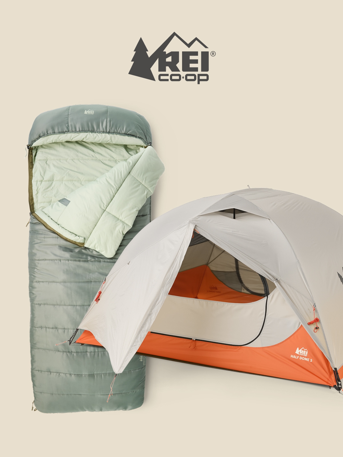 An R E I Co-op brand sleeping bag and tent on a light colored background.