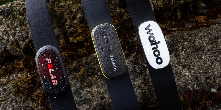 Three chest strap heart rate monitors, from Polar, Garmin and Wahoo Fitness.