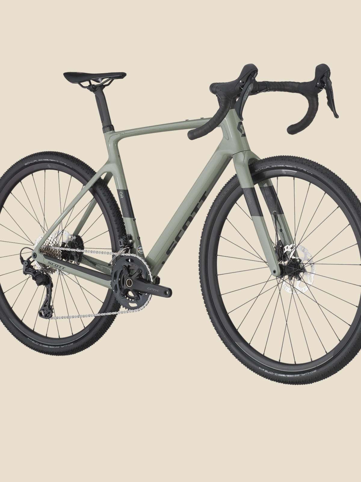 A green Scott bike on a light colored background.