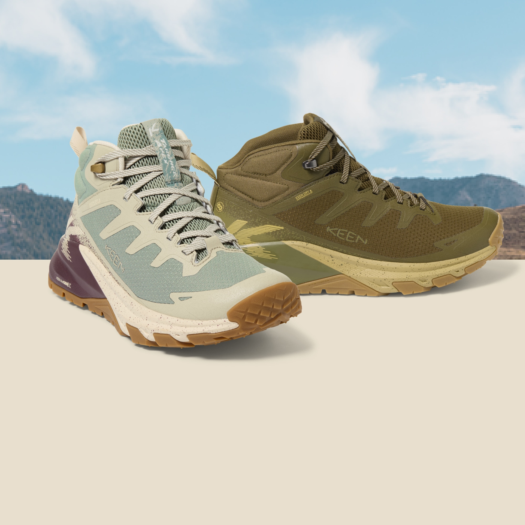Two Keen Targhee Apex Hiking boots with blue skies and a mountain range in the background.