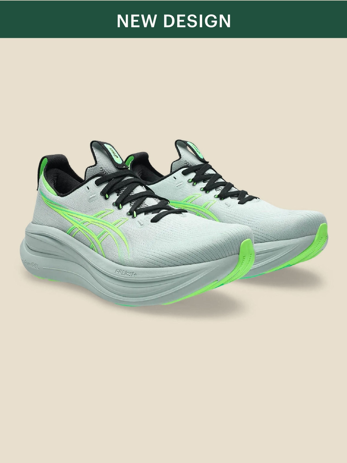 A pair of green ASICS running shoes on a light colored background.