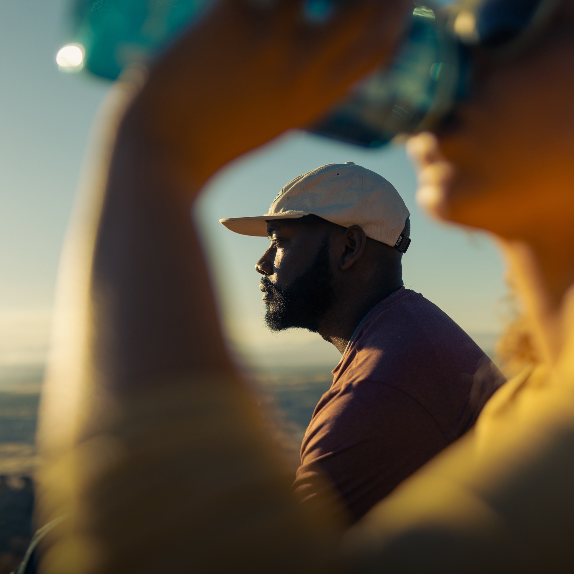 A person looks off into the distance on a sunny spring day.