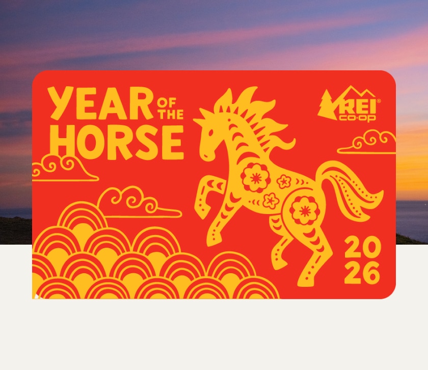 A Lunar New Year themed gift card with a horse that reads ‘Year of the horse’ over an image of a purple orange sunset.