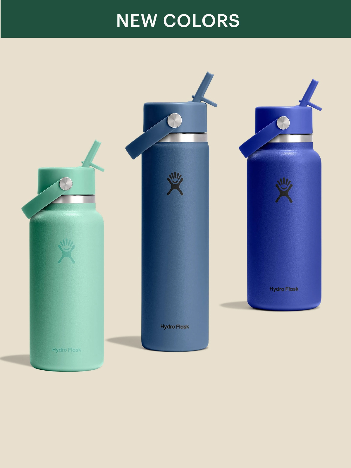 Three Hydro Flask bottles in new colors on a light colored background.