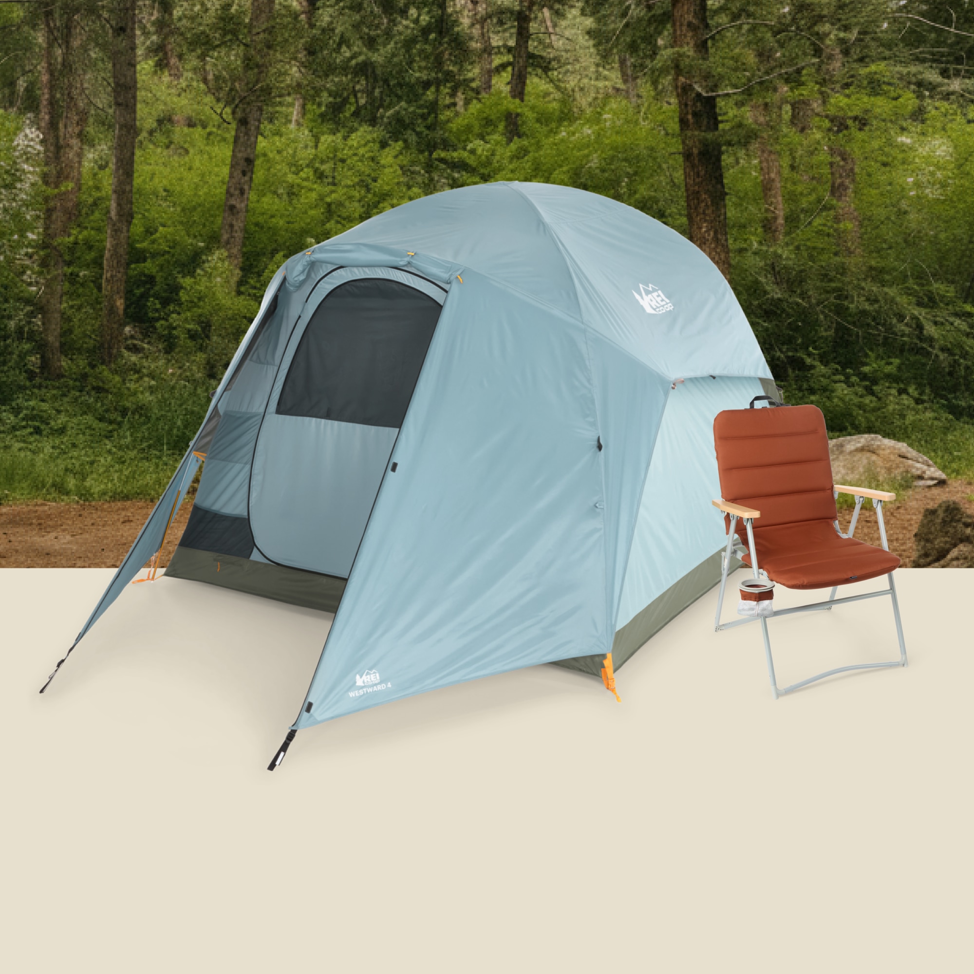 A tent and camp chair from the R E I Co-op Westward collection with trees in the background.