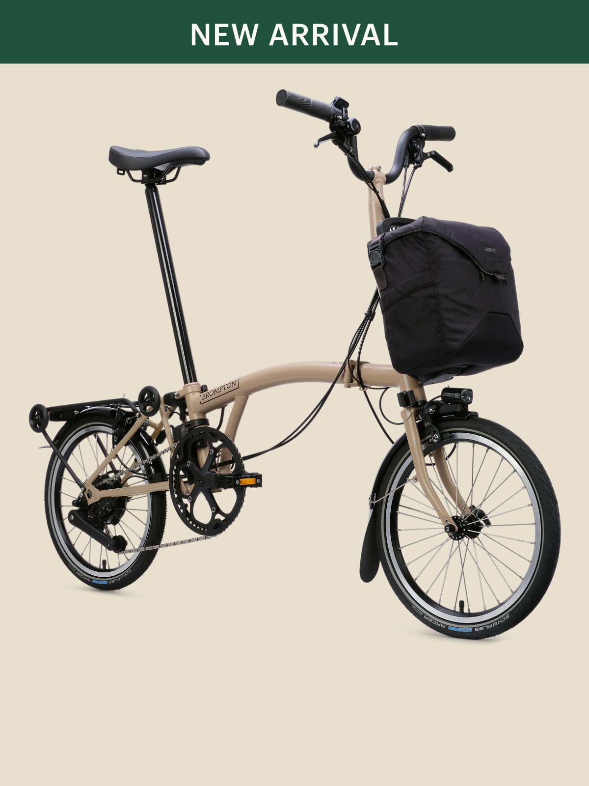 A Brompton bike on a light colored background.
