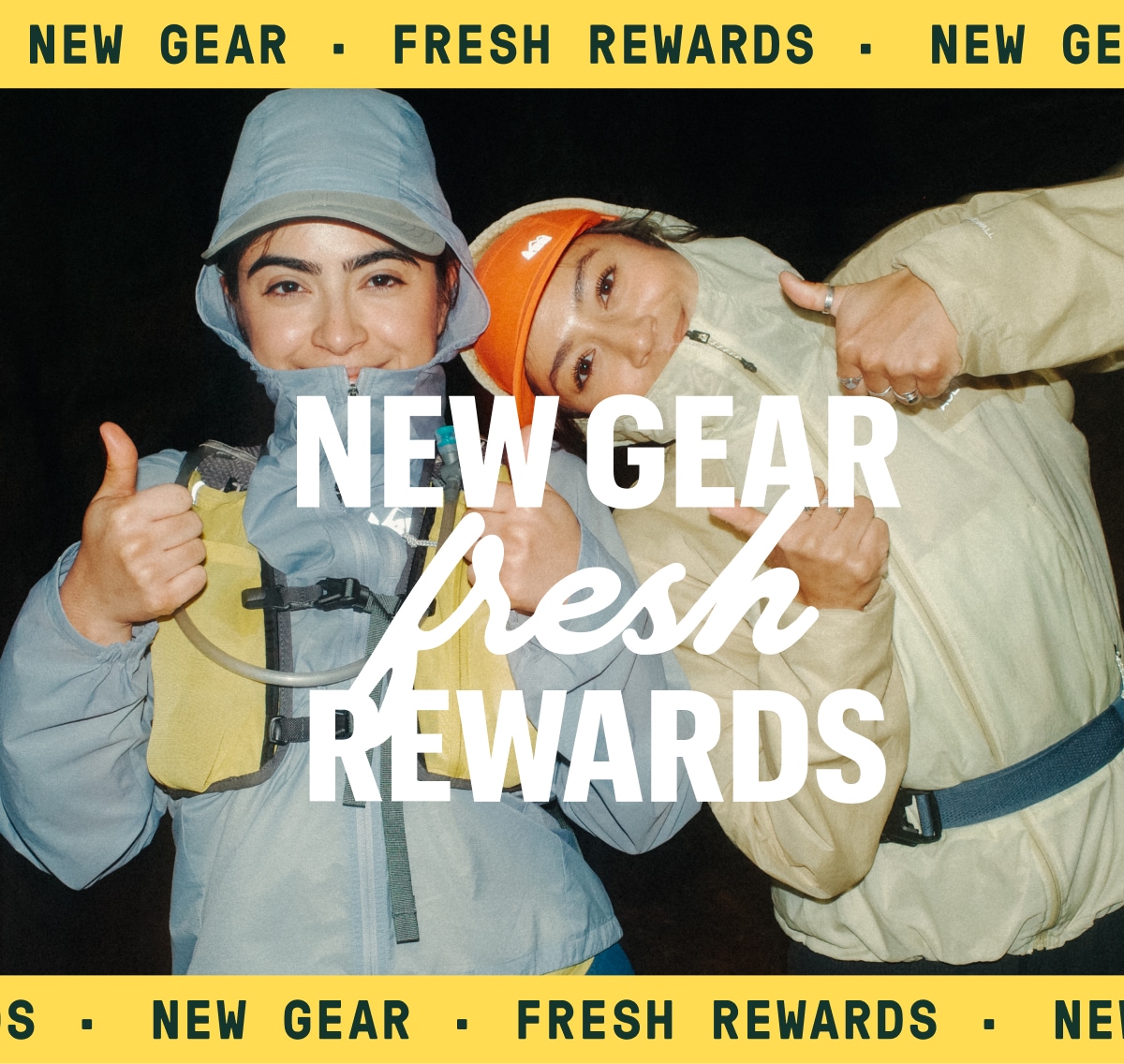 Text reads: ‘New gear, fresh rewards’ over a photo of two people posing with their thumbs up.