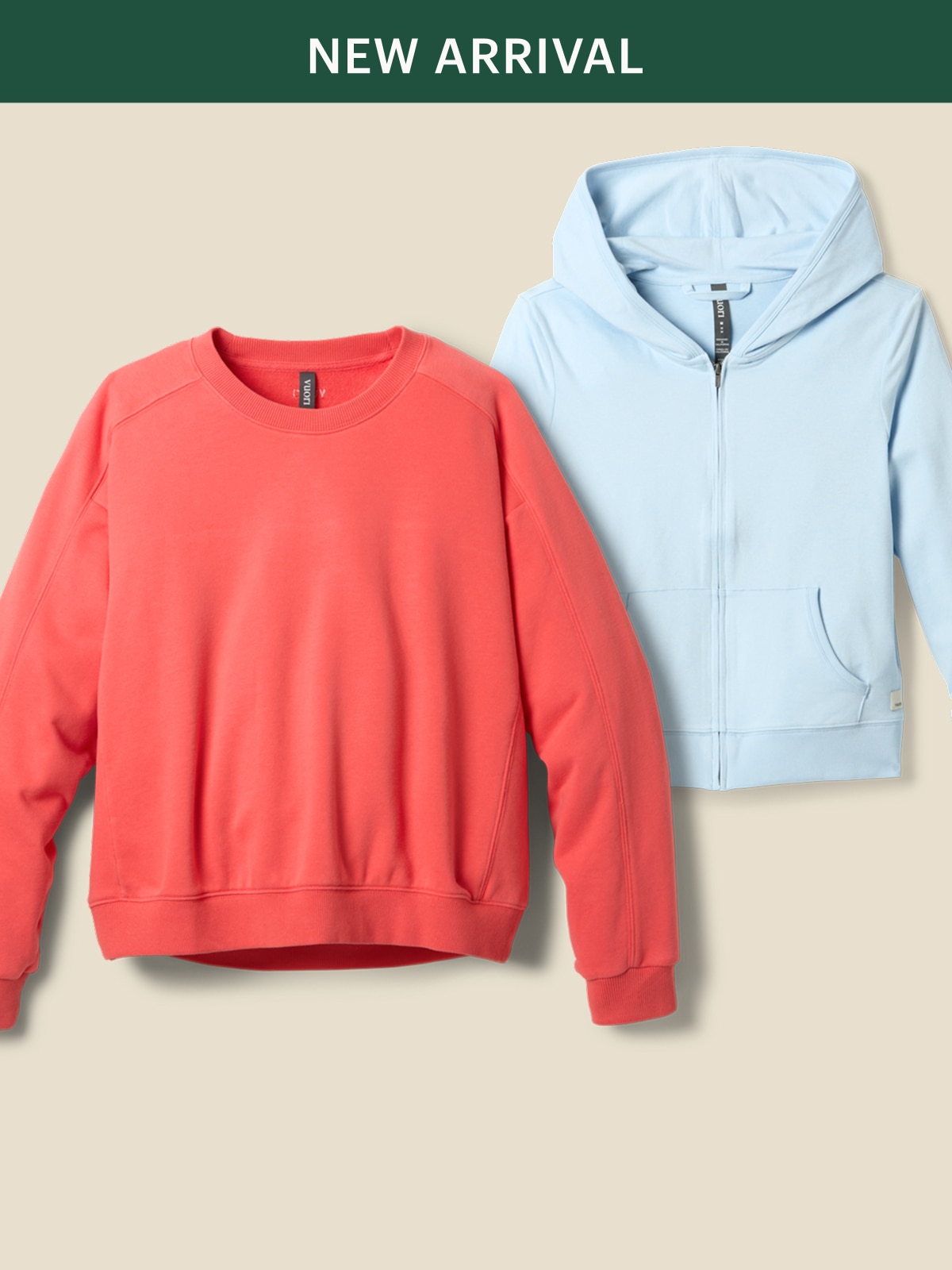 Two women’s Vuori tops on a light colored background.