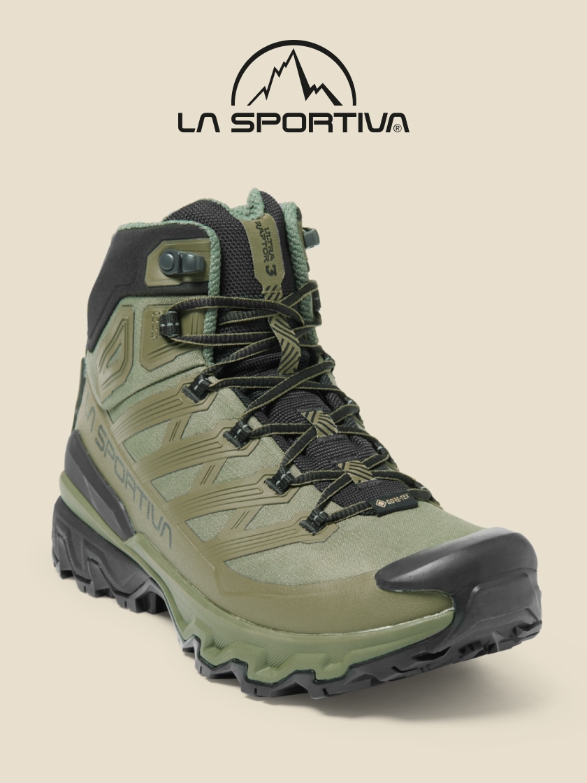 A green La Sportiva Ultra Raptor 3 hiking shoe on a light colored background.