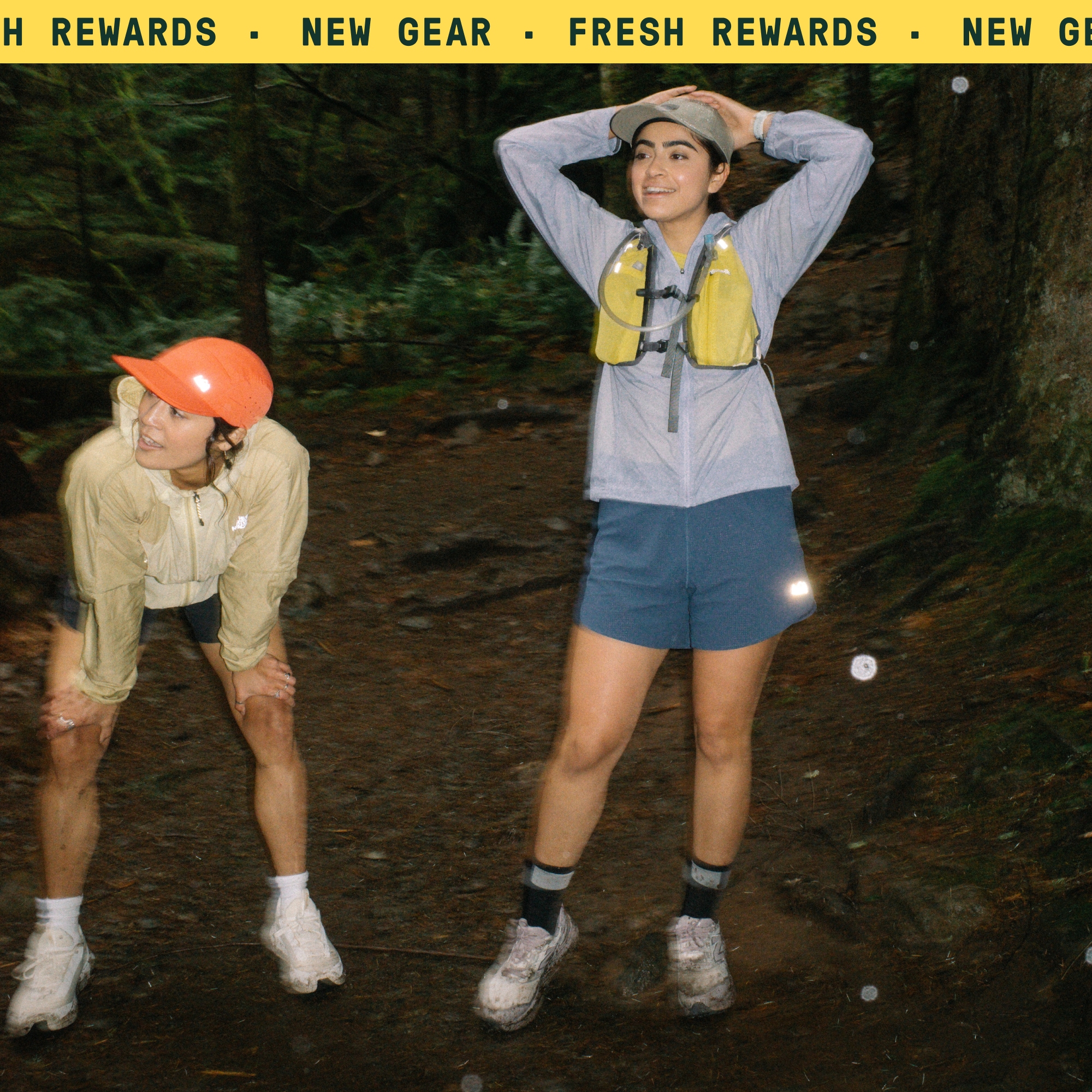Two people stop to take a break during their trail run.