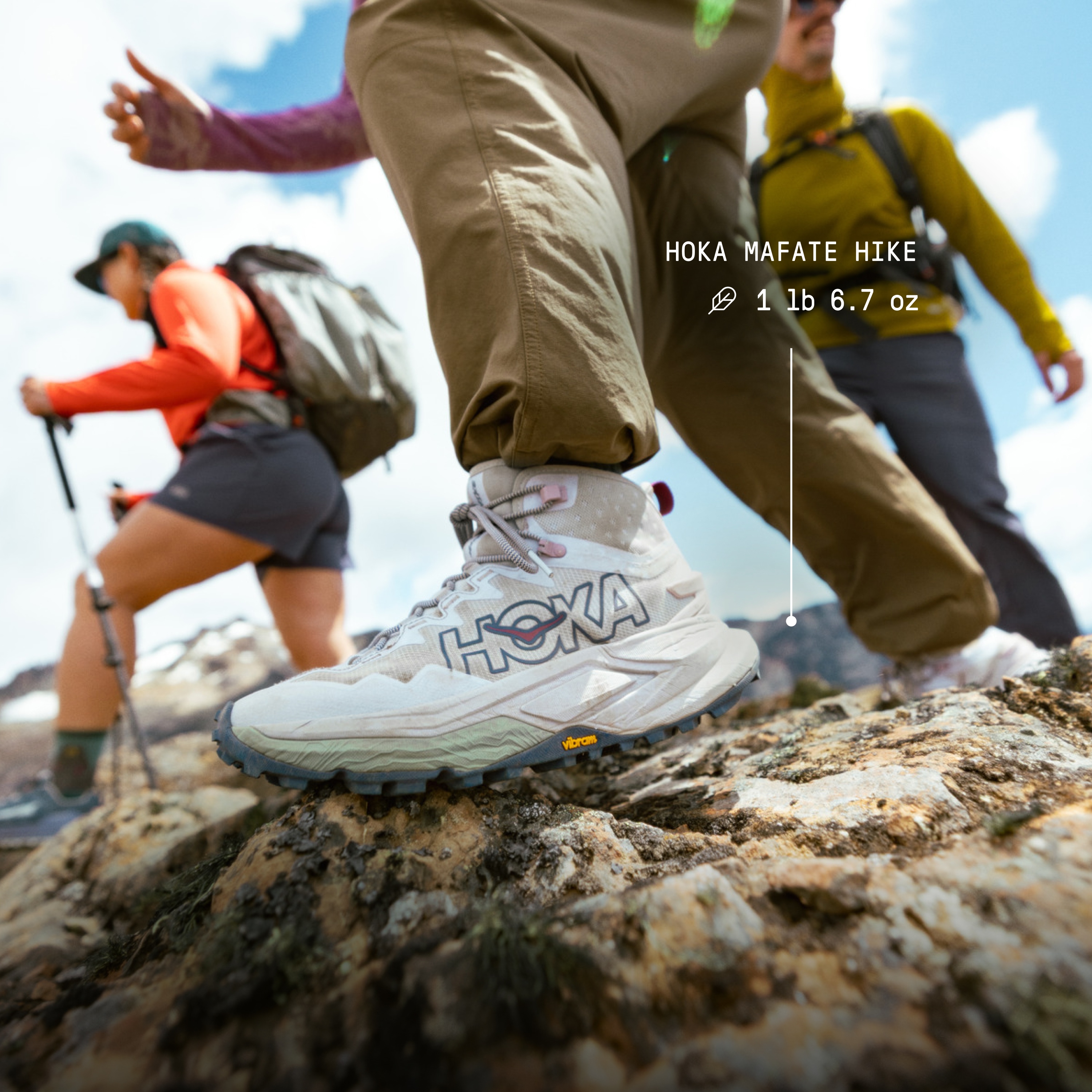 Text reads: ‘HOKA Mafate Hike. 1 pound, 6.7 ounces’ over an image of a group of people hiking over large rocks together.