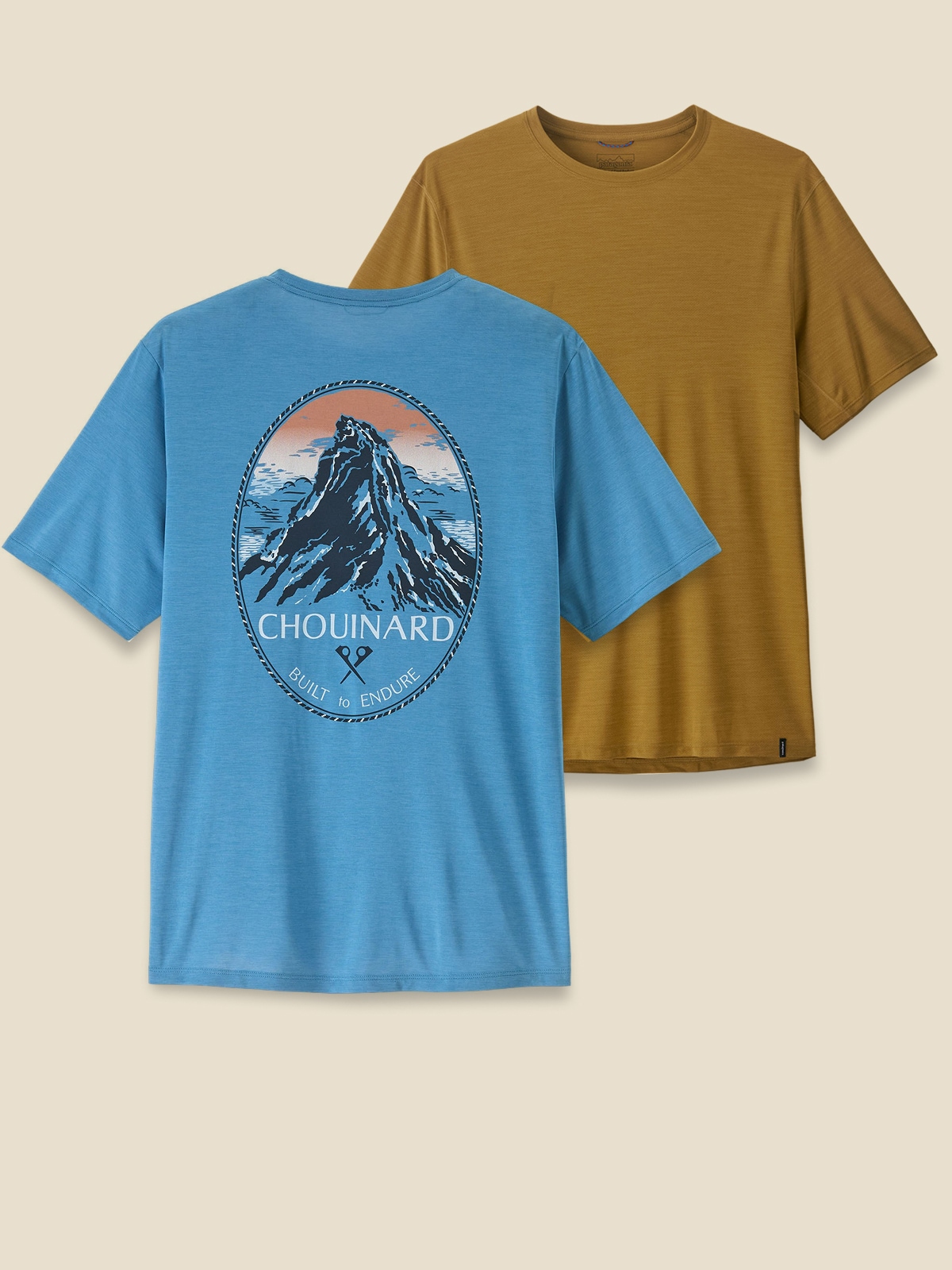 Two men’s short-sleeve t-shirts on a light colored background.