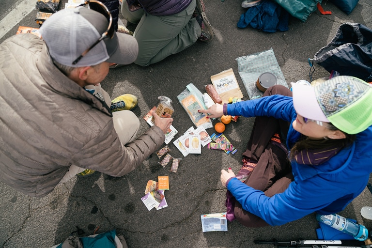 Photo of two people sorting through pack contents