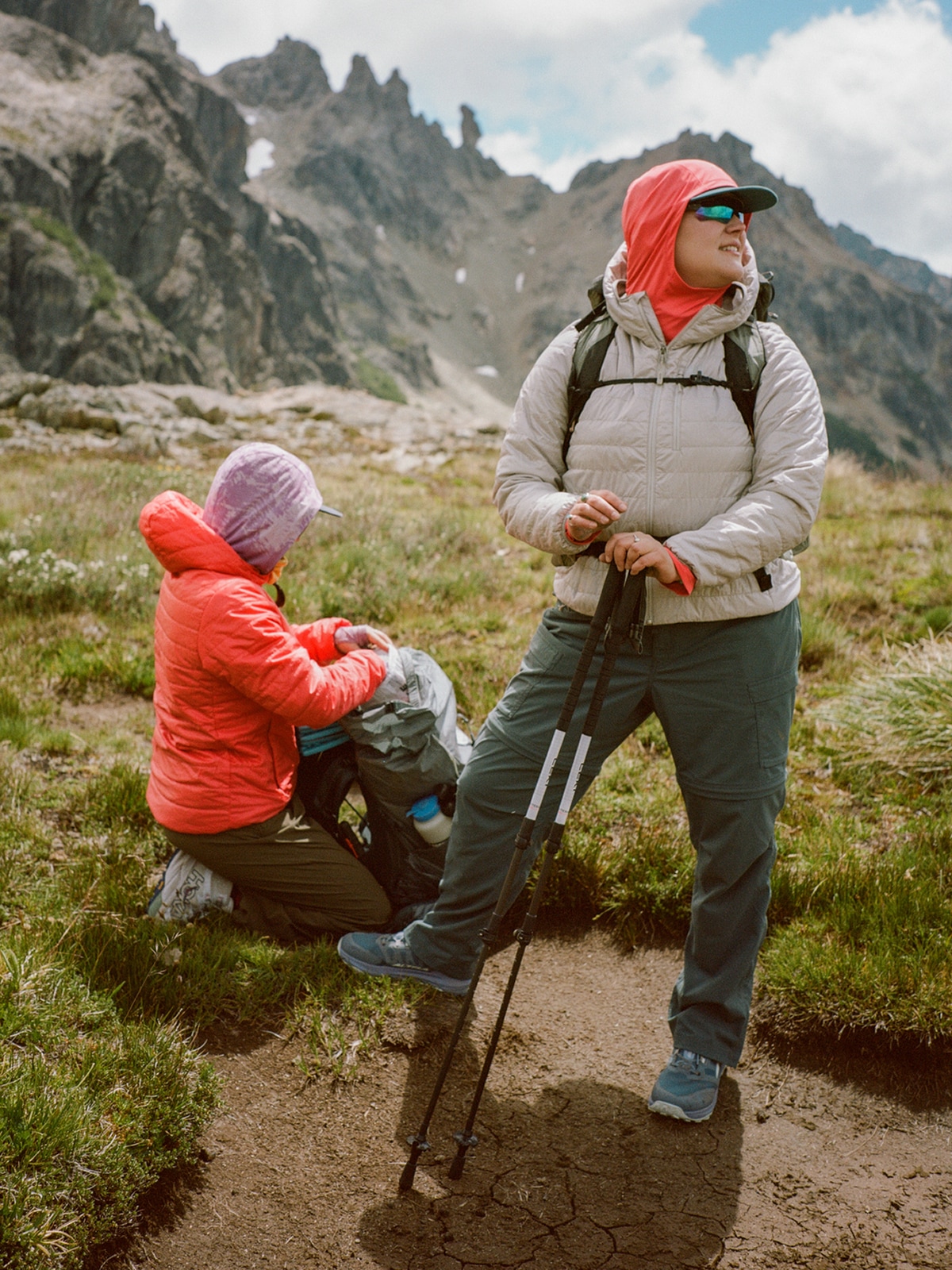 Two people stop to take a break during a hike.