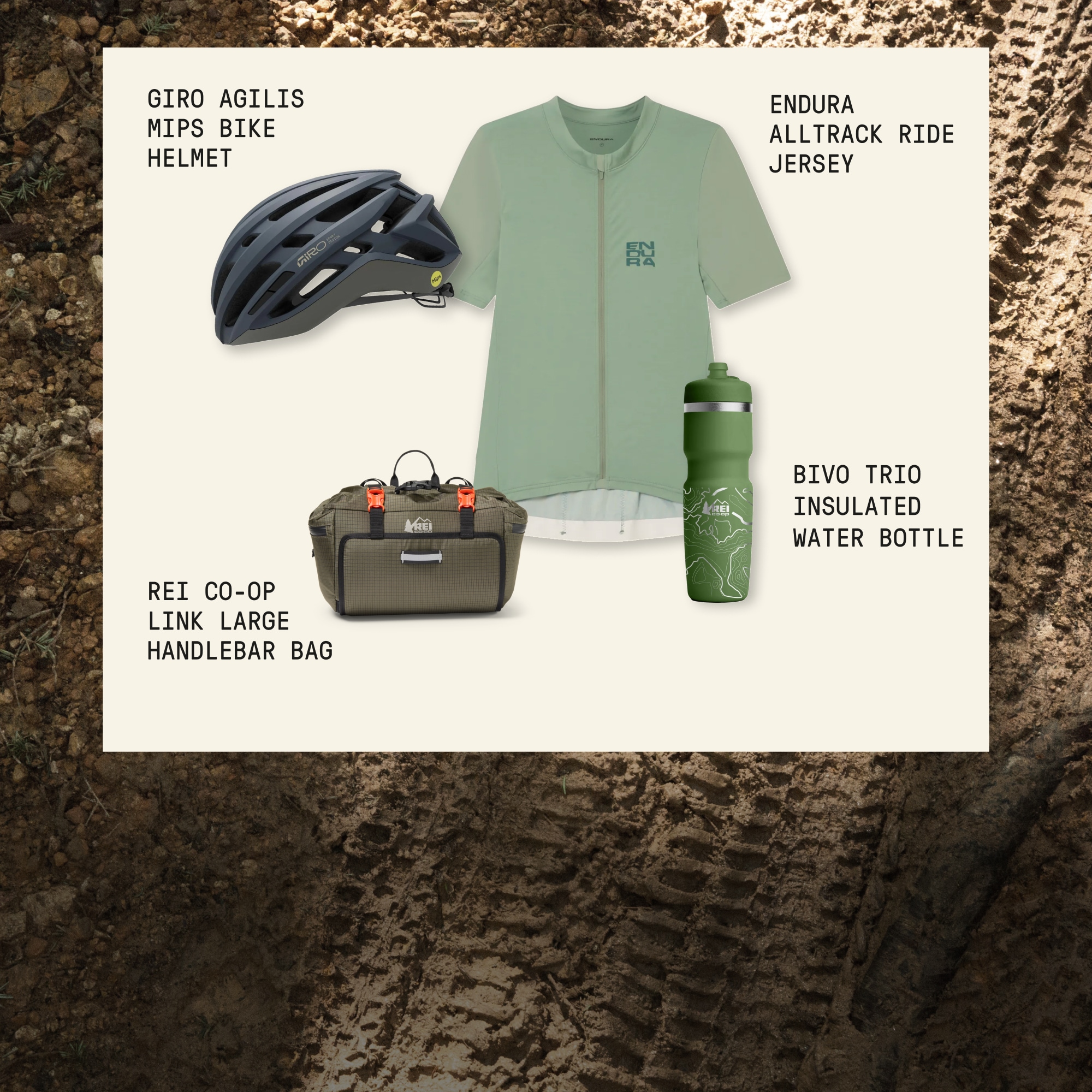 An Endura jersey, Giro bike helmet, R E I Co-op handlebar bag & Bivo insulated bottle on a light colored background over an image of dirt with tire tracks running through it.
