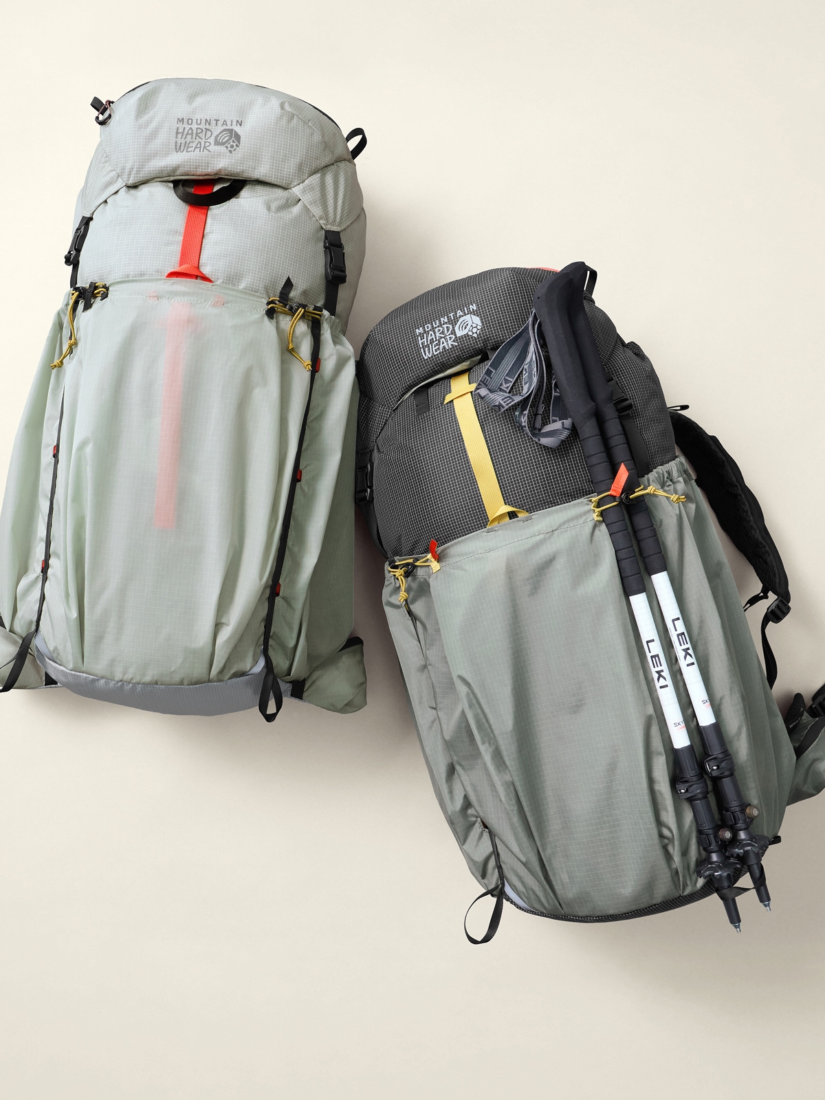 A person stops to grab something out of their R E I Co-op pack.