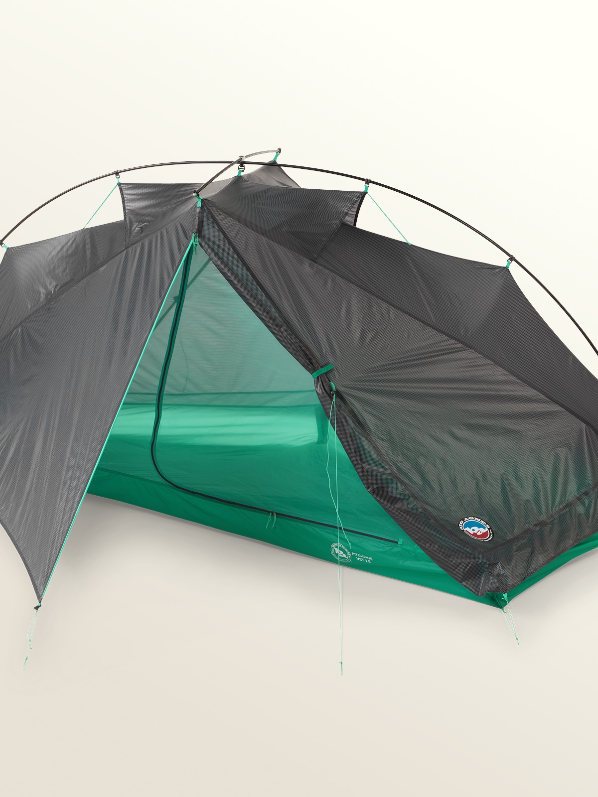 A person smiles for the camera while laying down in their Big Agnes tent.