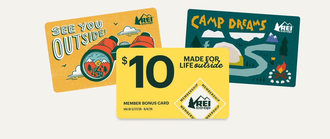 Two colorful outdoor themed gift cards and a yellow Member Bonus Card for $10 that reads ‘Made for life outside’ on a light colored background.